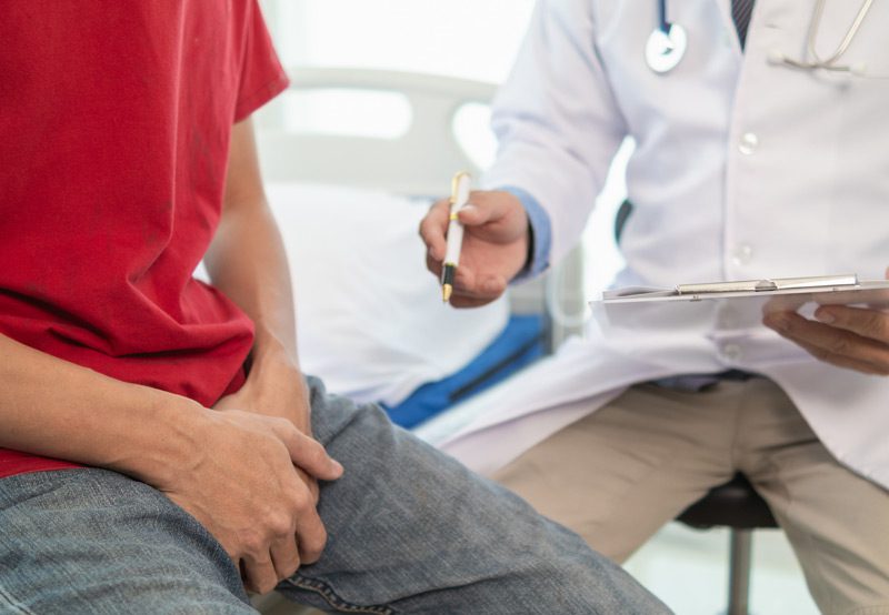 Male-patient-consulting-with-doctor
