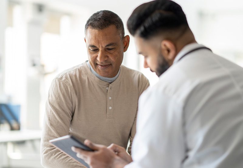 Patient-reviewing-test-results-with-doctor